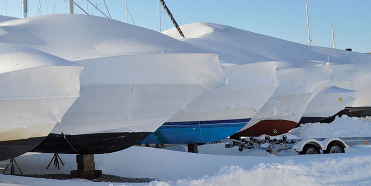 Shrink wrapped boats on winter day