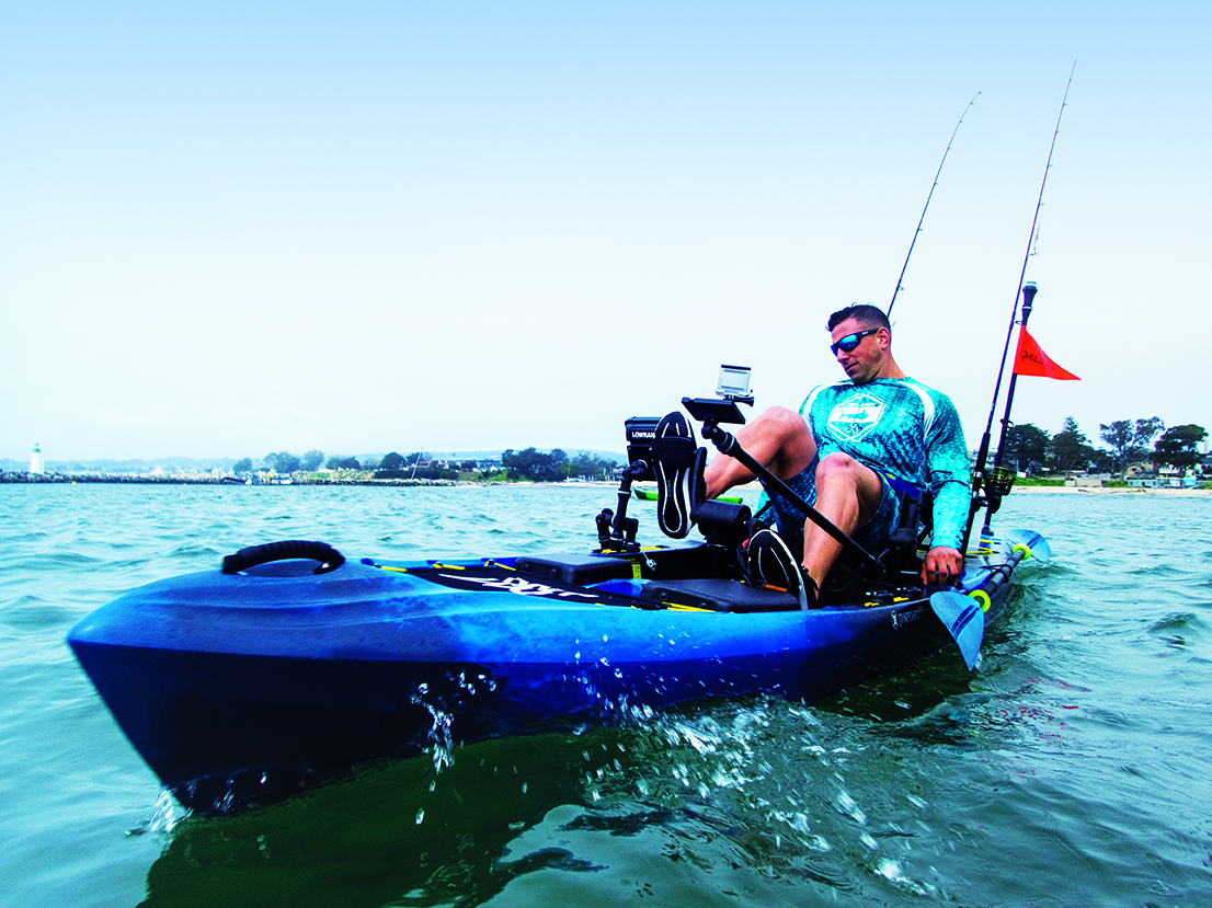 Man peddling kayak