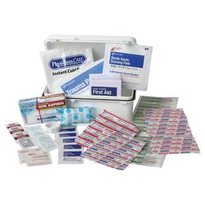 First aid kit open with contents displayed around it