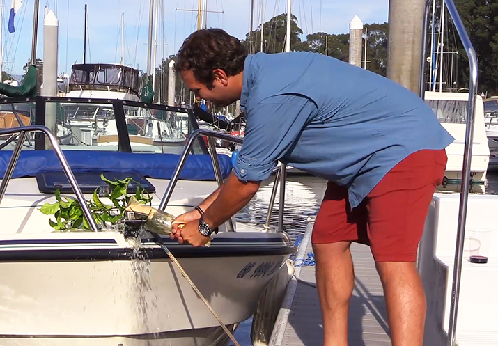 breaking the bottle on the anchor roller