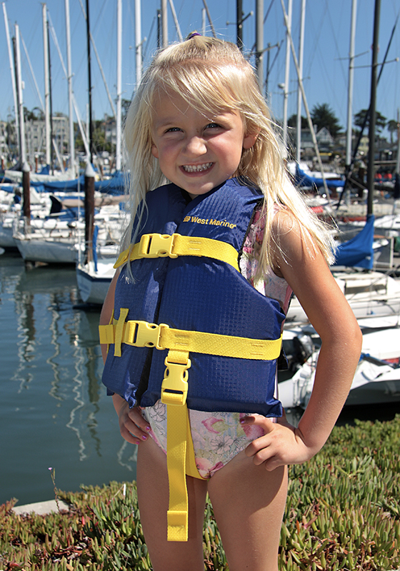 Cute little girl modeling life jacket