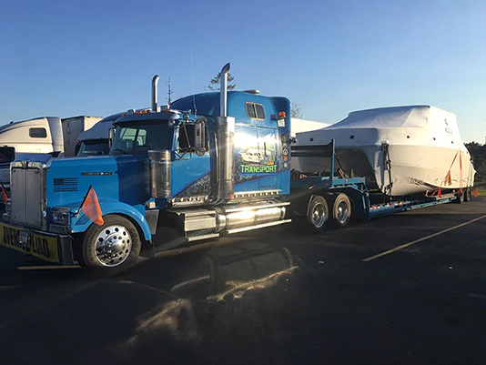 Blue Truck, Boat Haulers, domestic boat shipping, boat movers, flat rack