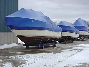 Shrink wrapped boats layed up on cradles