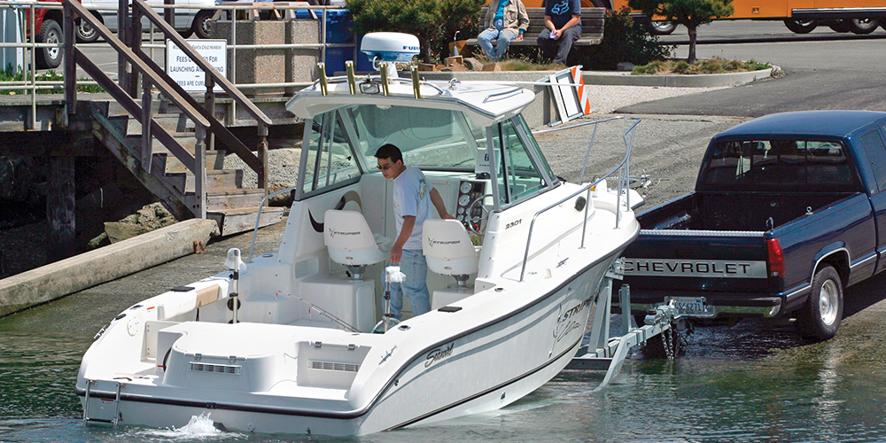 Fishing boat being launched at launch ramp
