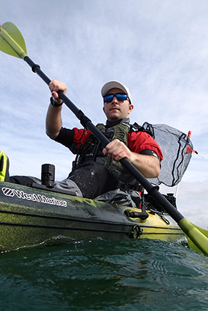 person paddling a kayak