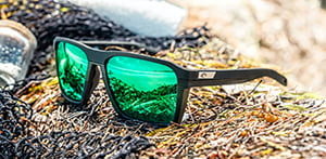 Costa sunglasses next to fishing net