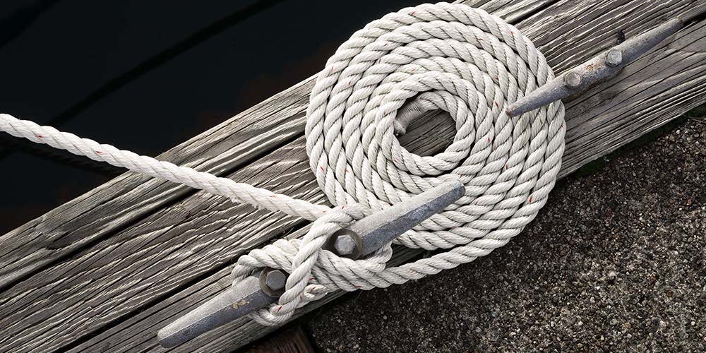 Three-strand dock line made fast to a cleat