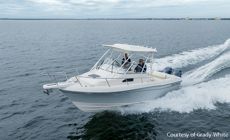 Walkaround boat planing through water
