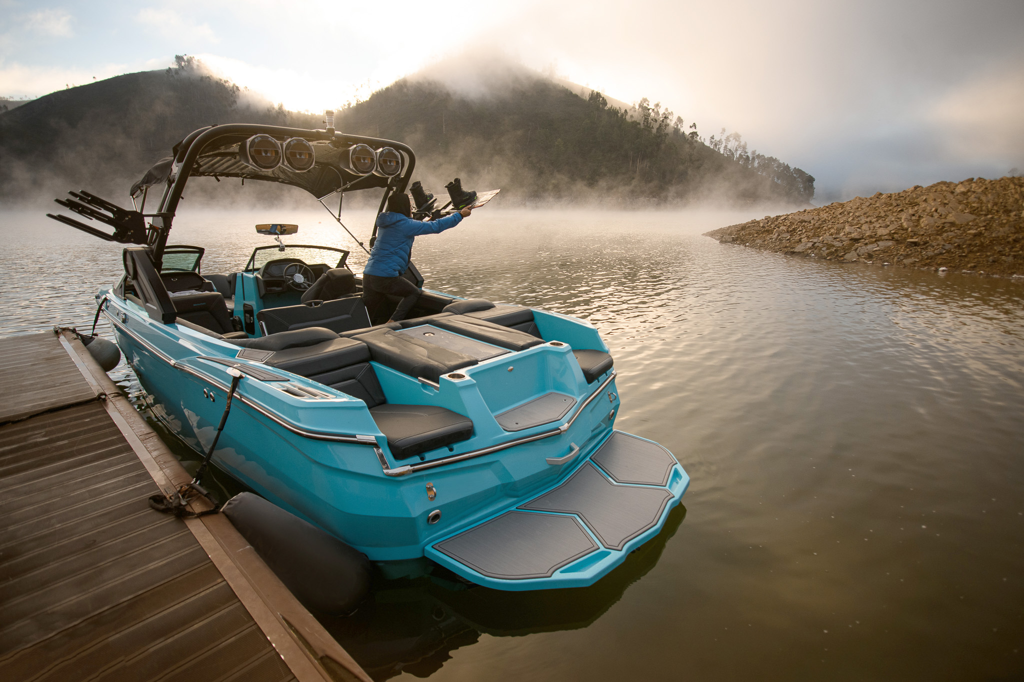 a powerboat with an inboard engine and a wakeboard tower