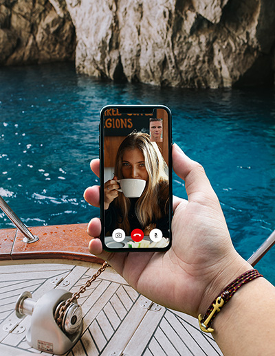 someone taking a video call on their boat