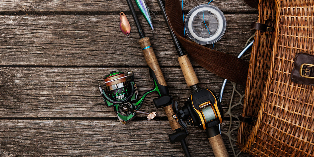 Spinning and baitcasting rod and reel setups next to creel