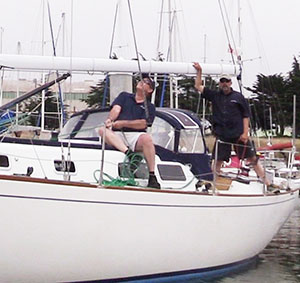 2 people easing someone down using 2 halyards