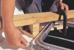 using a jig, c-clamp and a blade to remove the old hatch