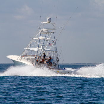 Large power boat with outriggers